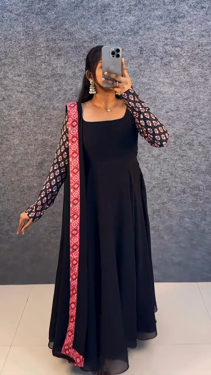 stunning portrait of a young woman exuding grace and poise in a traditional black Anarkali outfit.(JORJET)