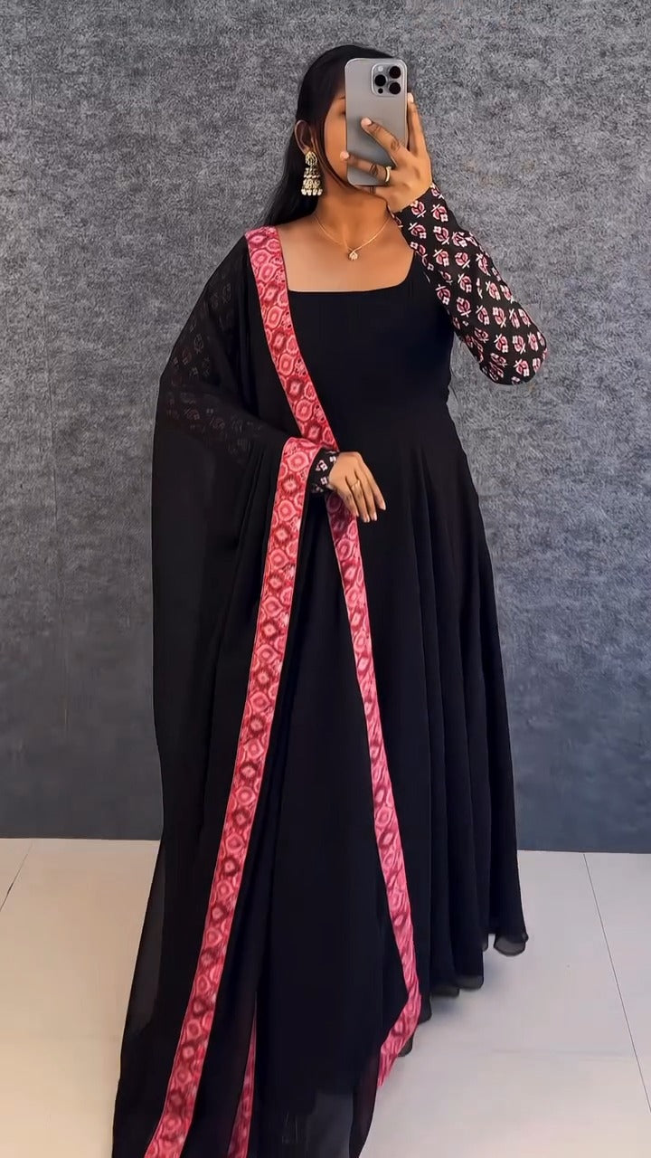 stunning portrait of a young woman exuding grace and poise in a traditional black Anarkali outfit.(JORJET)