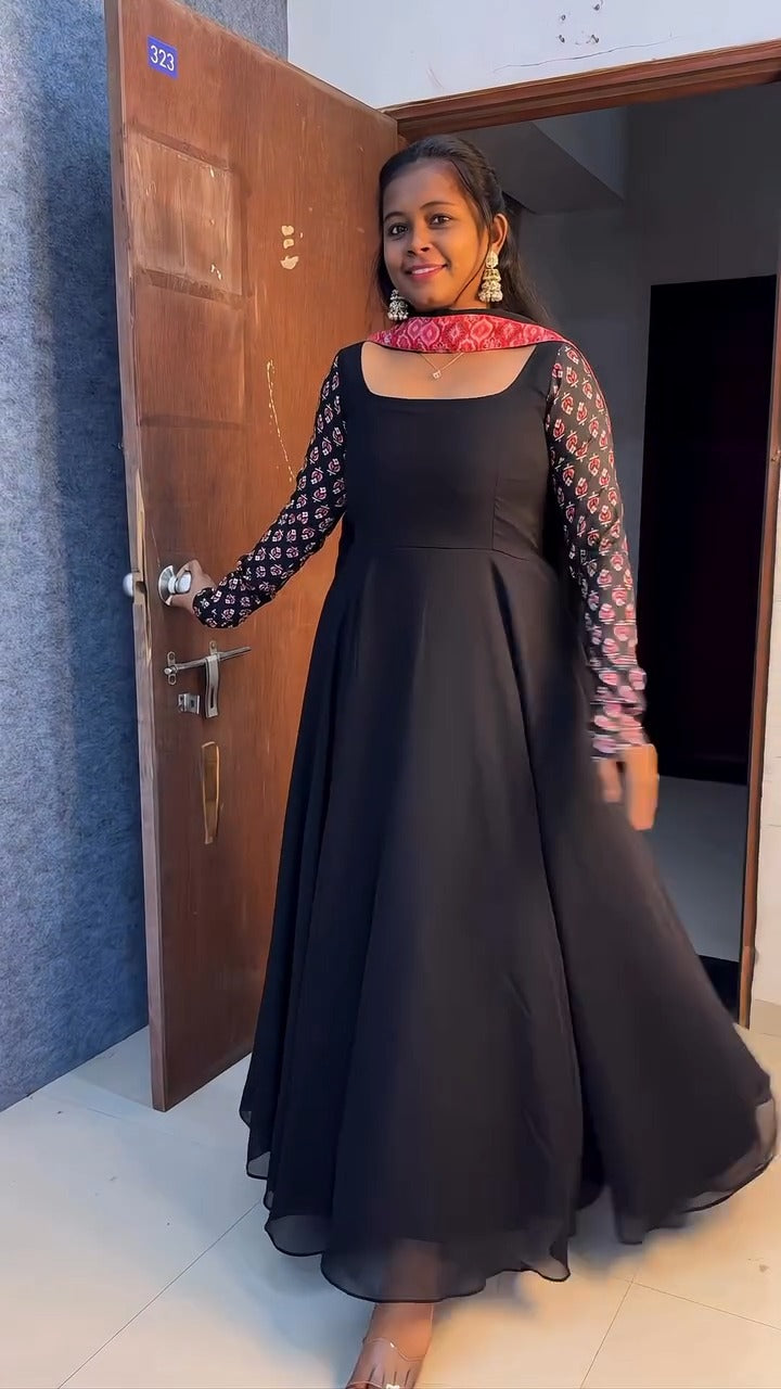 stunning portrait of a young woman exuding grace and poise in a traditional black Anarkali outfit.(JORJET)