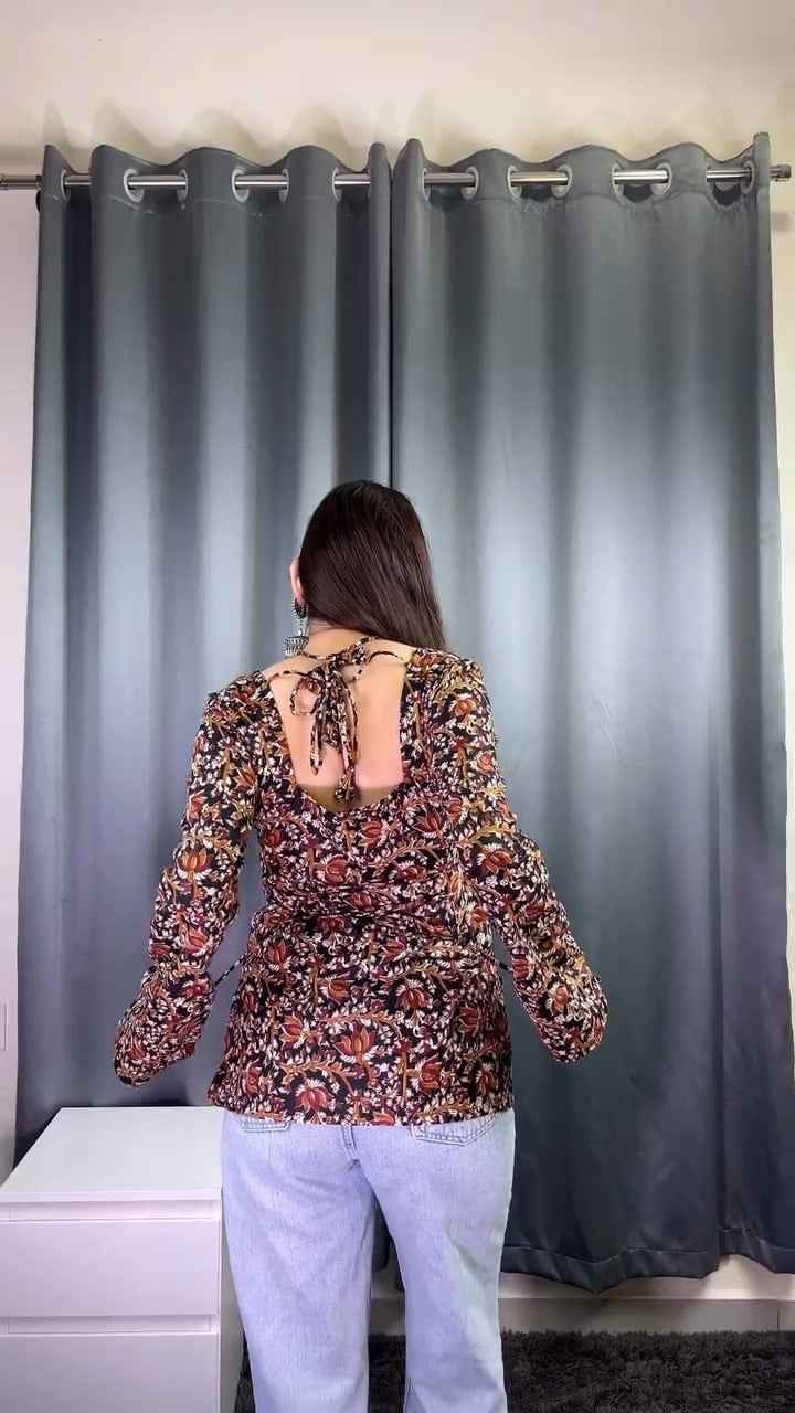 floral printed top or tunic( fabric is likely breathable, Poly rayon)