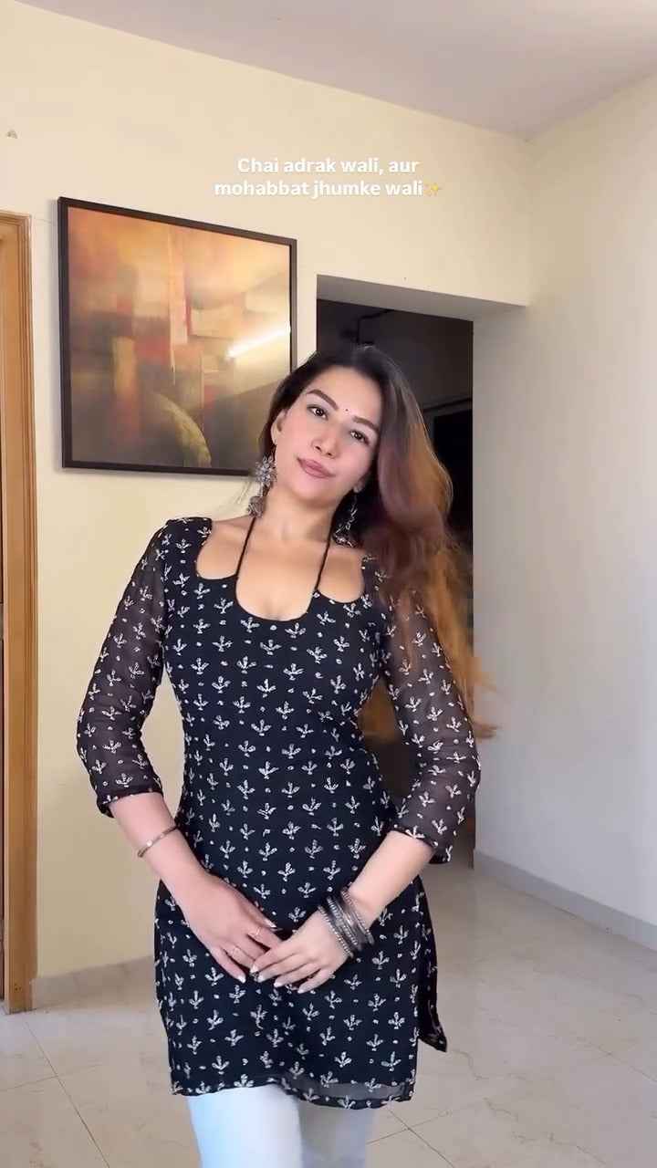 stunning black kurti with delicate prints,