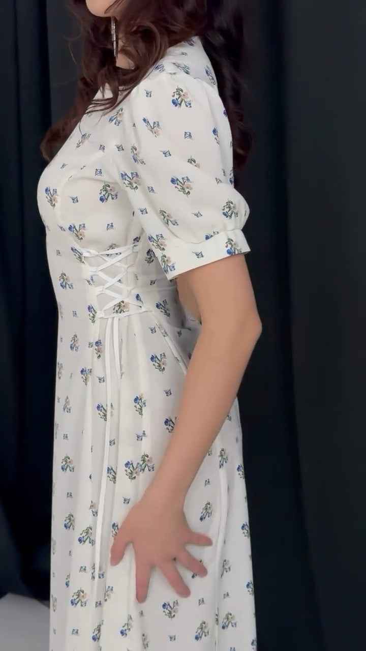 white midi dress with a blue floral print ( fabric is likely breathable, Poly rayon)