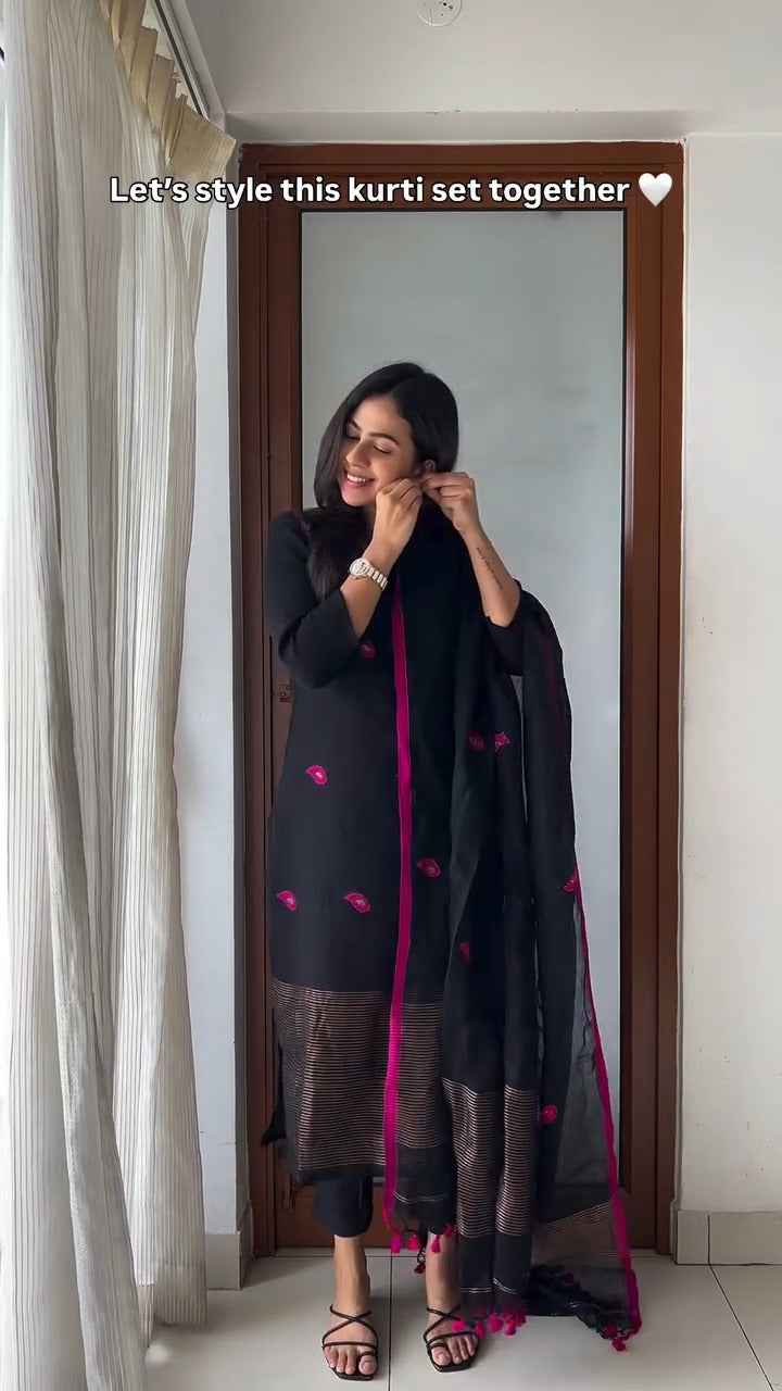 black kurti set with vibrant pink embroidery,