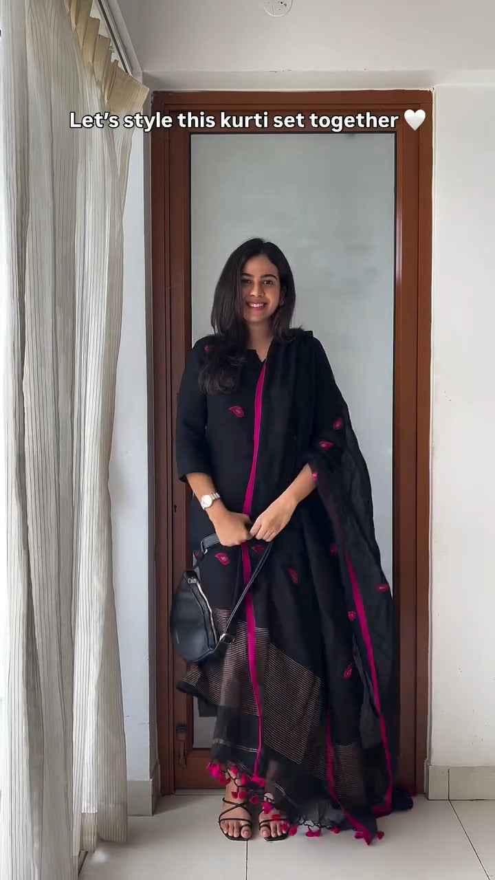 black kurti set with vibrant pink embroidery,
