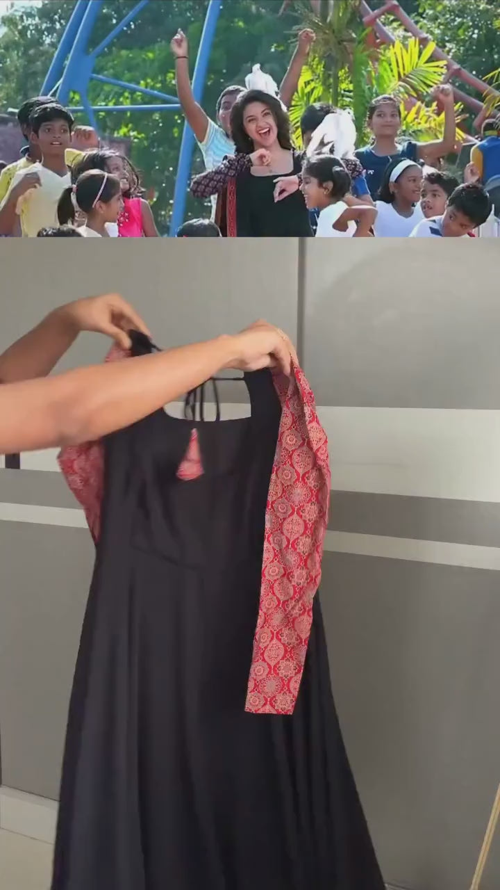 stunning portrait of a young woman exuding grace and poise in a traditional black Anarkali outfit.(JORJET)